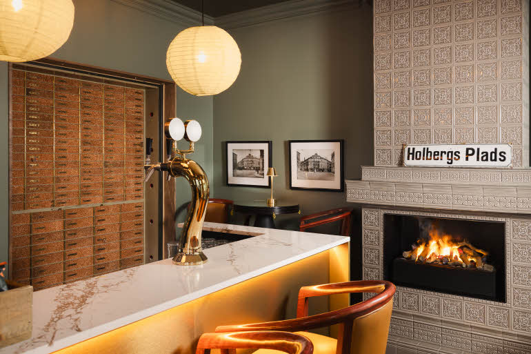 Fireplace and old safety deposit boxes, Scandic Holberg