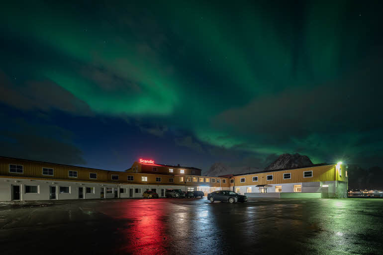 Facade and Northern lights over hotel Scandic Vestfjord Lofoten