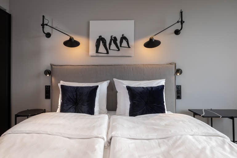 bed in standard room at scandic grand central helsinki