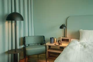 Chair and nights stand in superior room at scandic landvetter in gothenburg