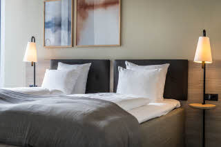 bed in master suite room at scandic spectrum