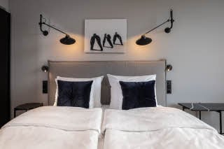 bed in standard room at scandic grand central helsinki