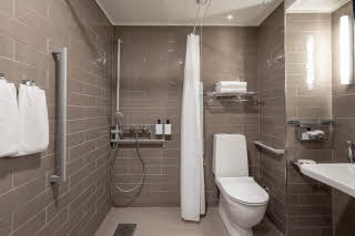 standard twin accessibility bathroom at scandic rovaniemi city in finland