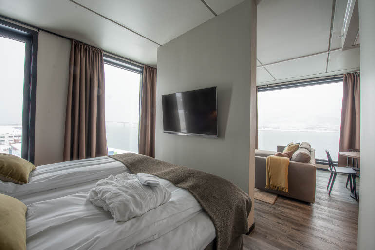 bed and tv in master suite at scandic sortland