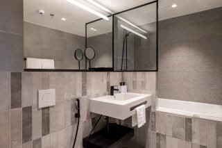 guest room bathroom at scandic helsinki hub