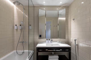 Bathroom with bathtub at Scandic Grand Central Helsinki