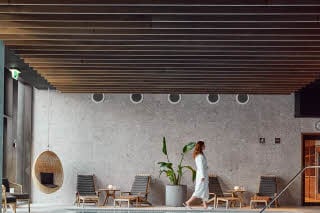 Woman beside the wellness pool