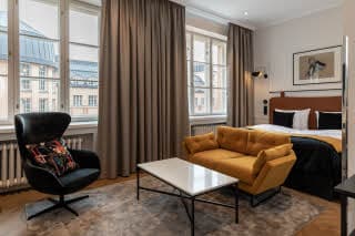 sitting area in superior room at scandic grand central helsinki