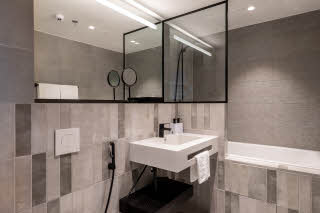 guest room bathroom at scandic helsinki hub