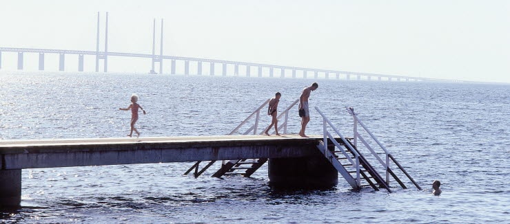 Kids can swim at Amager Strandpark with Oresund Bridge in the background